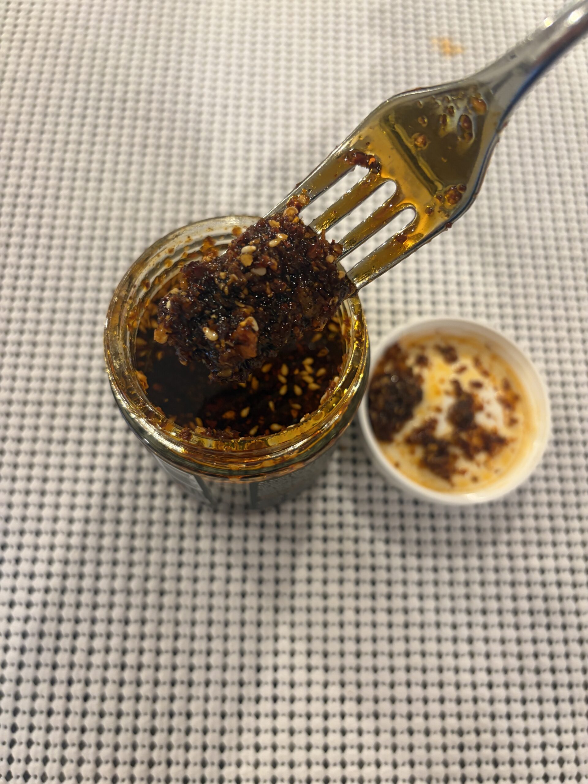 Sauce Up Extra Spicy chili crisp close-up fork pull — Flavor Index Lab