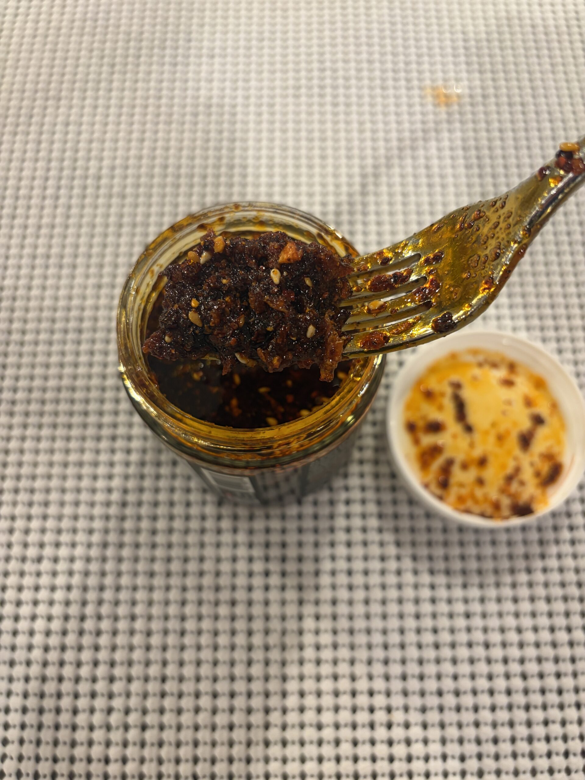 Sauce Up chili crisp fork pull showing thick texture — Flavor Index Lab