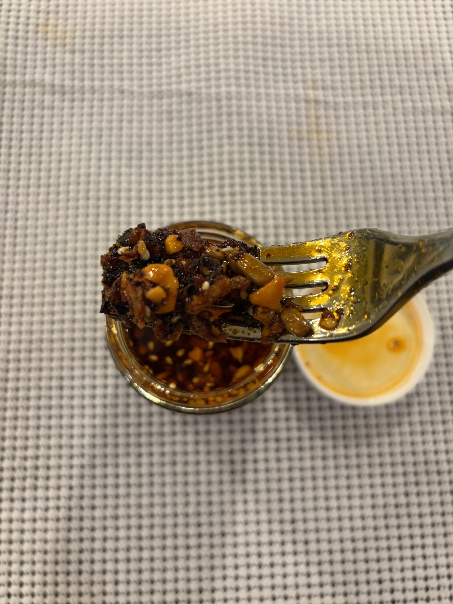 Sauce Up salsa macha fork pull showing thick texture — Flavor Index Lab