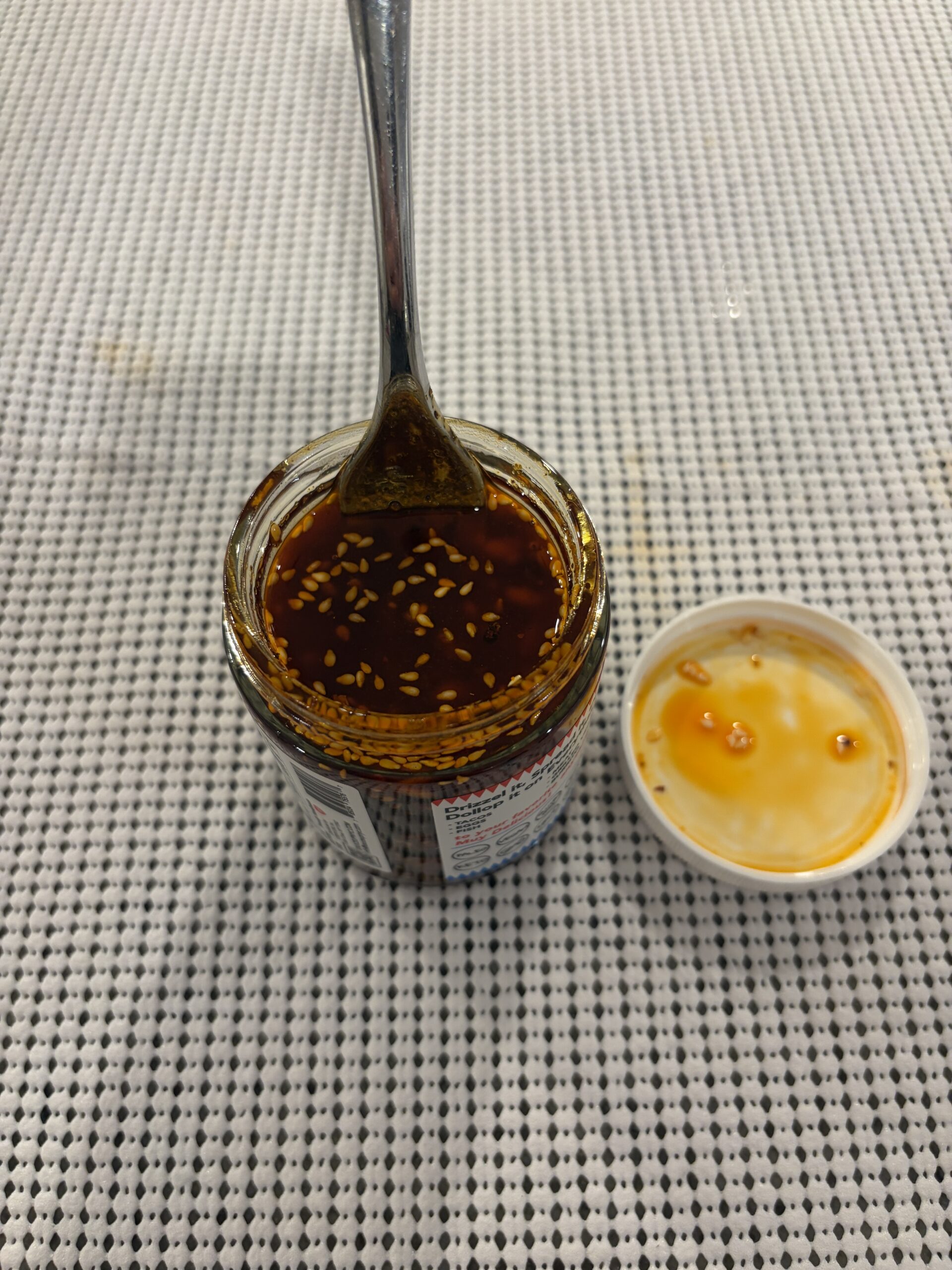 Sauce Up salsa macha stirred showing chunky texture — Flavor Index Lab