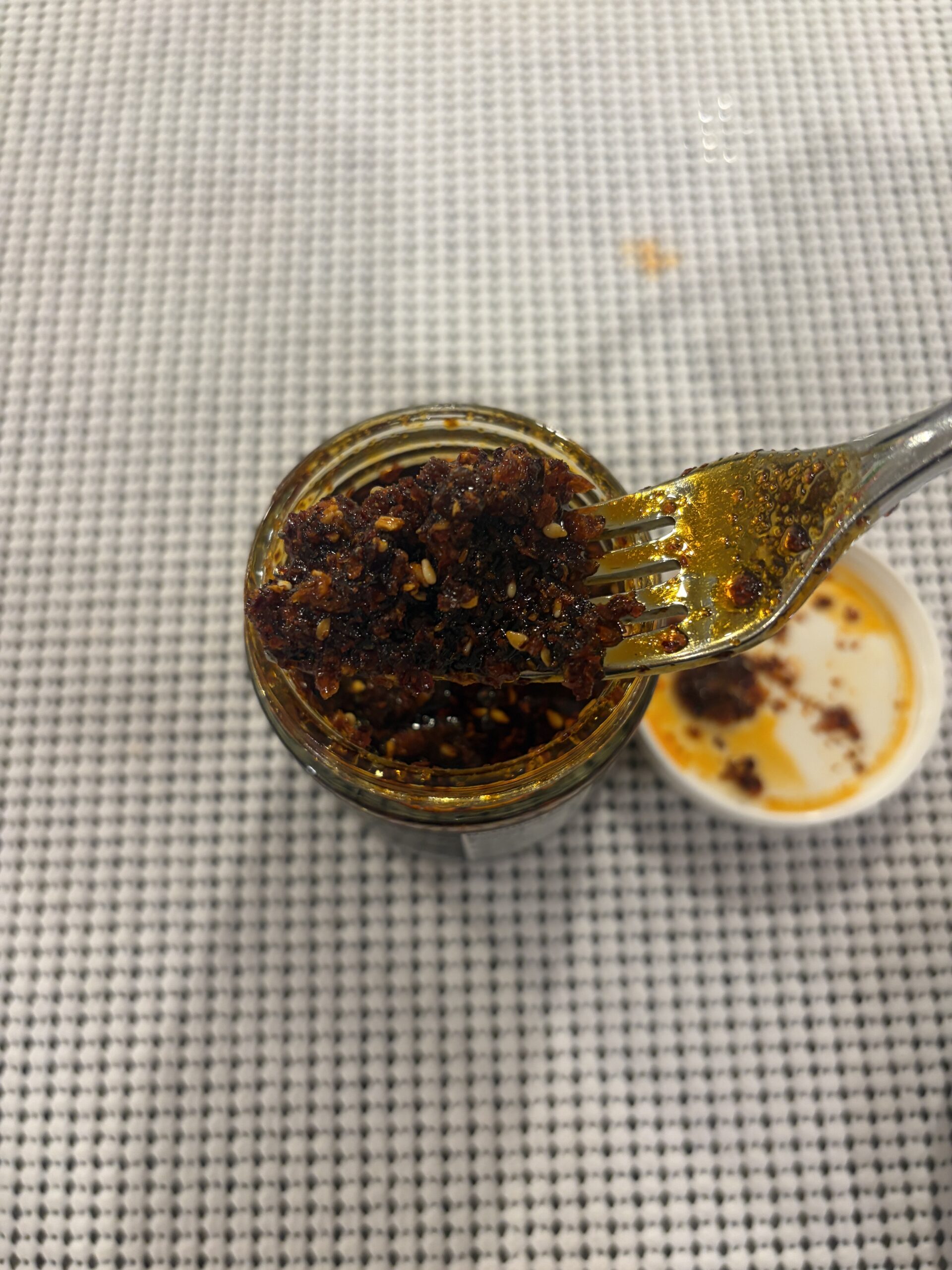 Sauce Up White Truffle chili crisp fork pull showing oil and crispy bits — Flavor Index Lab