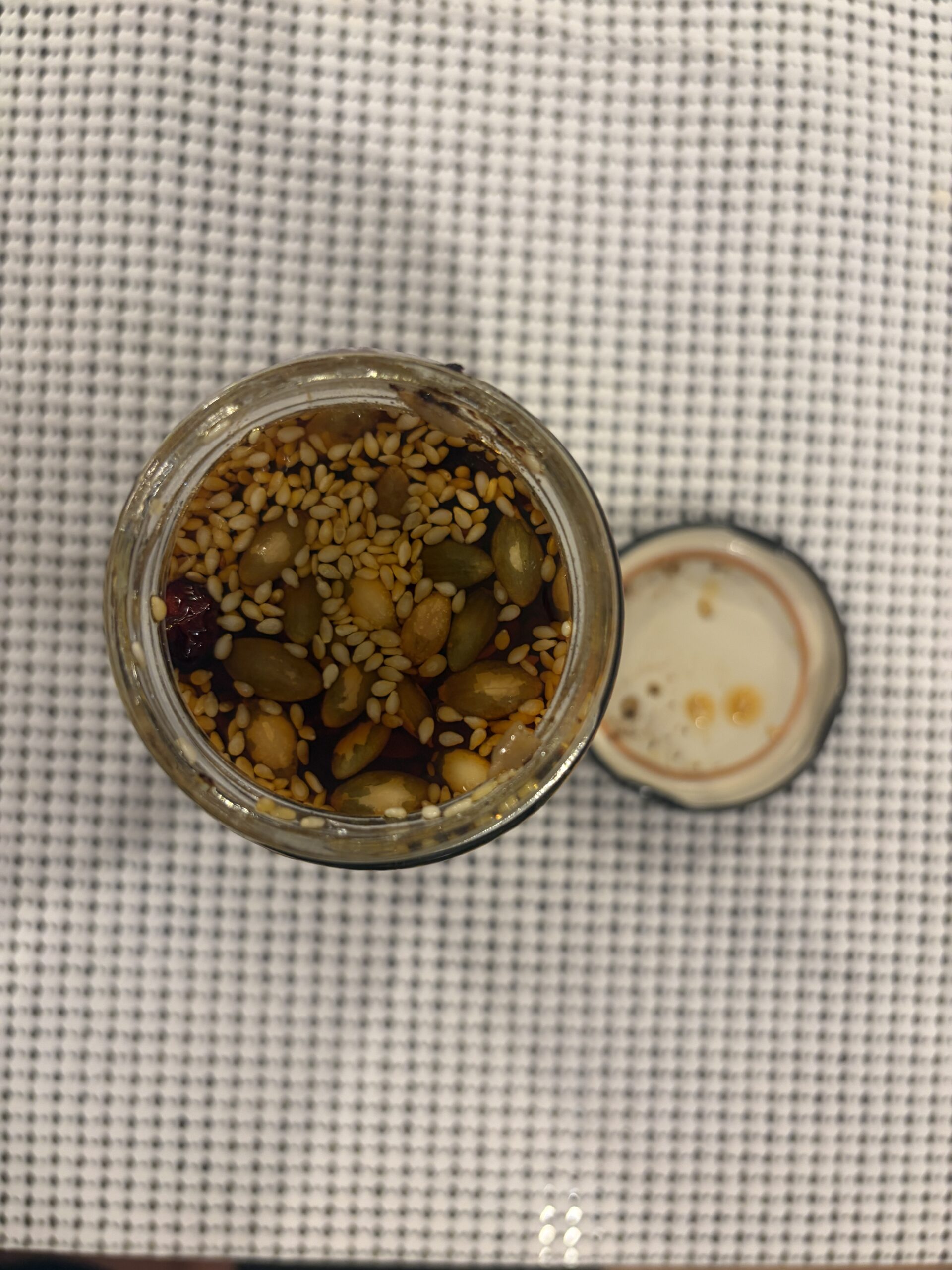 Tia Lupita Sweet Cranberry salsa macha open jar showing seeds and cranberries — Flavor Index Lab