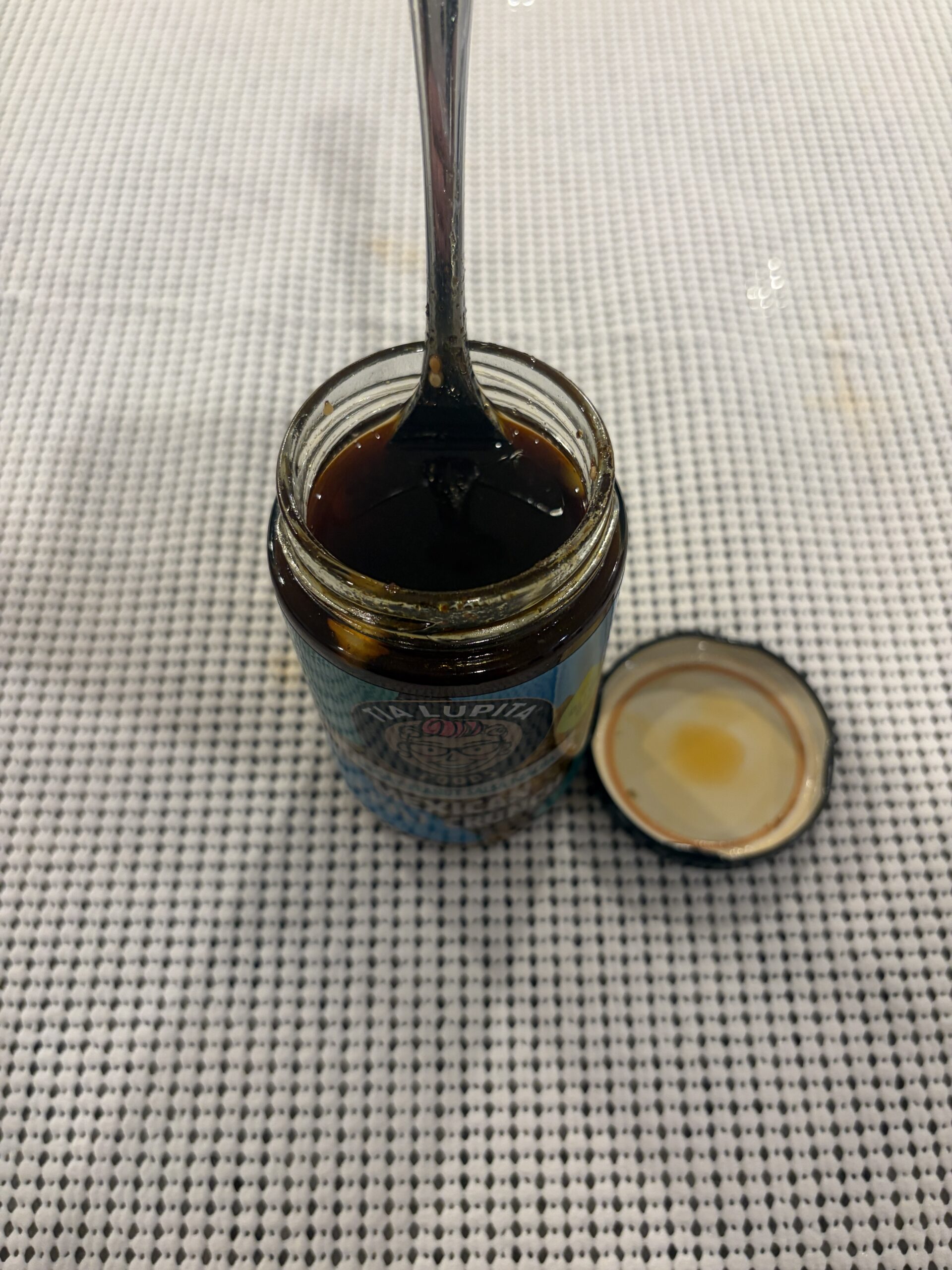 Fork resting on Tia Lupita Savory Peanut salsa macha solids — Flavor Index Lab