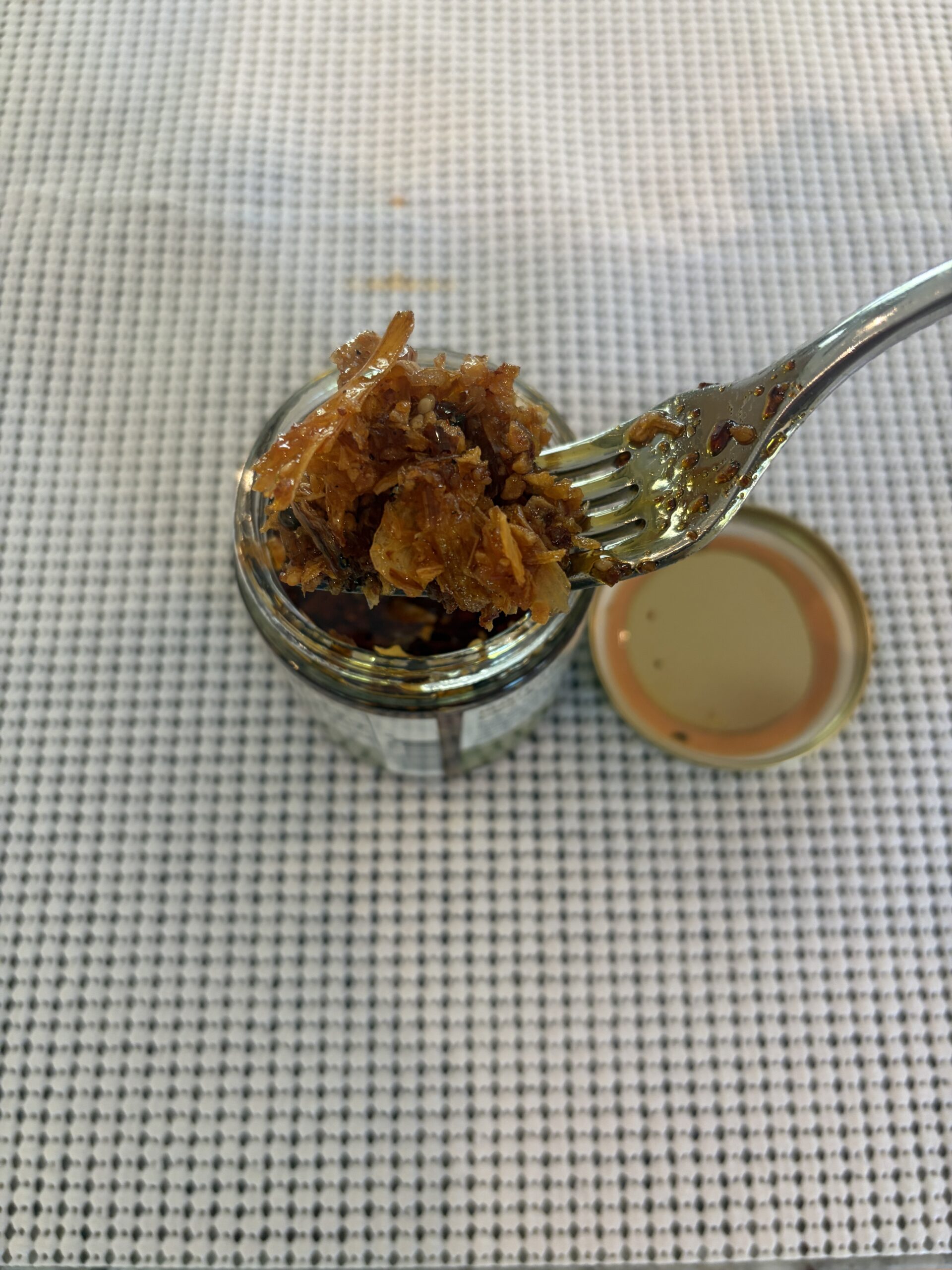 Umami Hottie Crispy Crunchy chili oil close-up of fried garlic and sesame — Flavor Index Lab