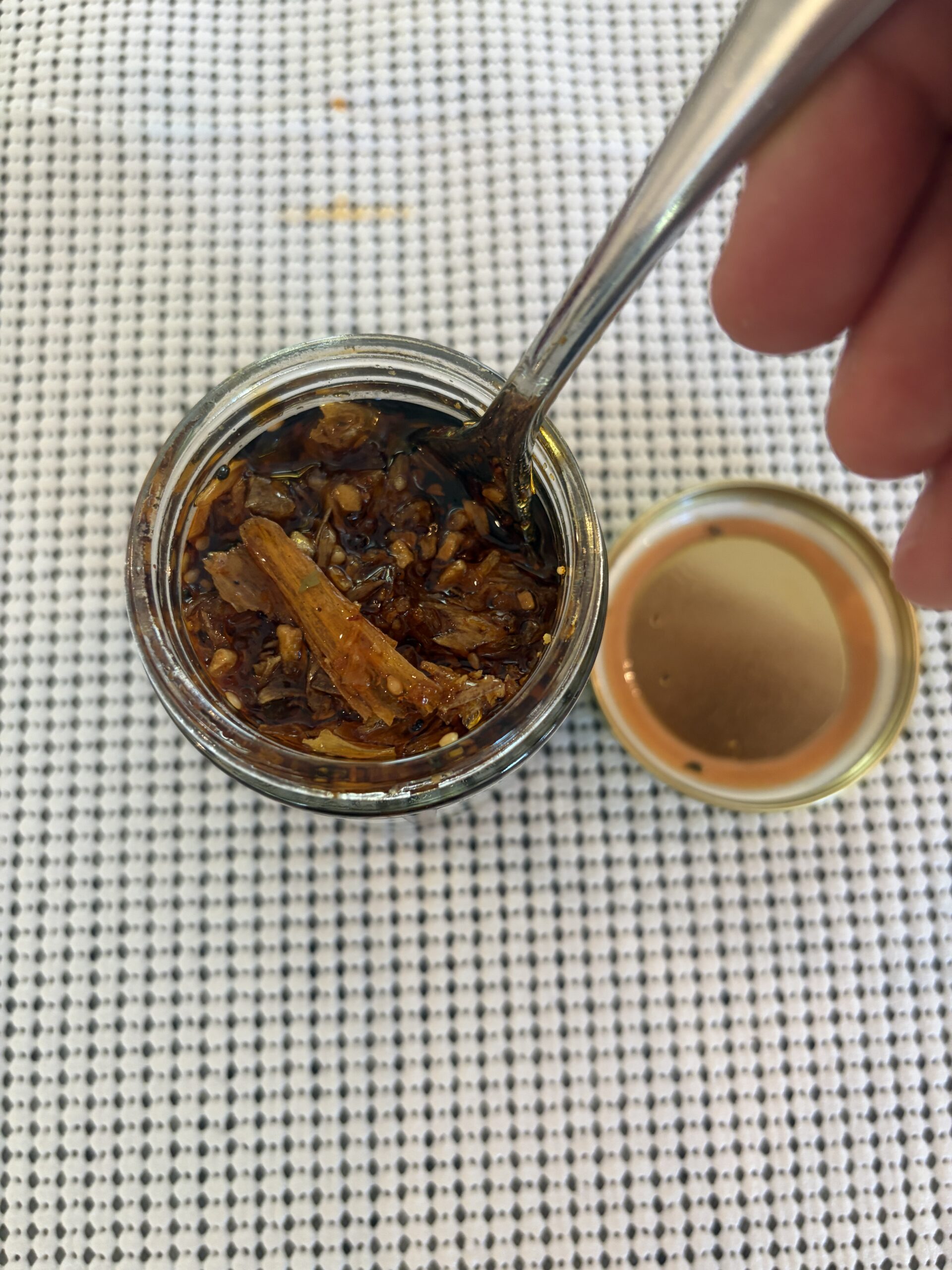 Umami Hottie Crispy Crunchy chili oil fork pull showing solid density — Flavor Index Lab