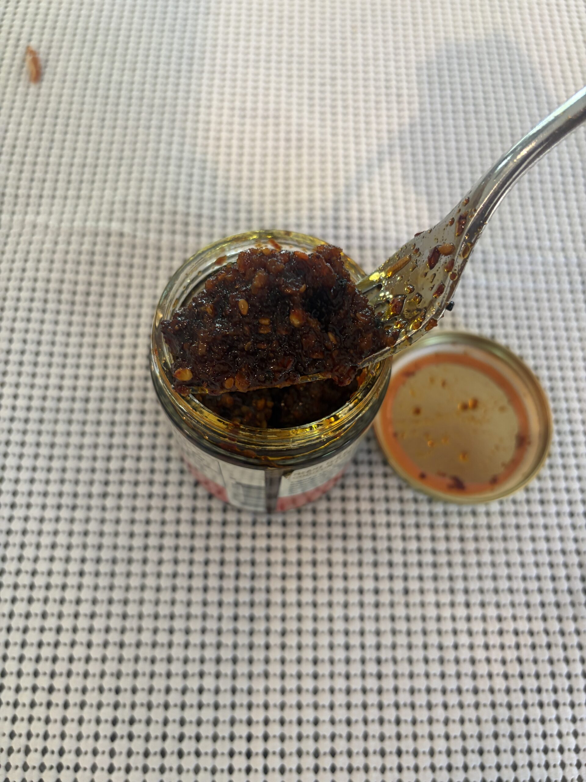 Umami Hottie Original Heat chili oil thick paste consistency on fork — Flavor Index Lab