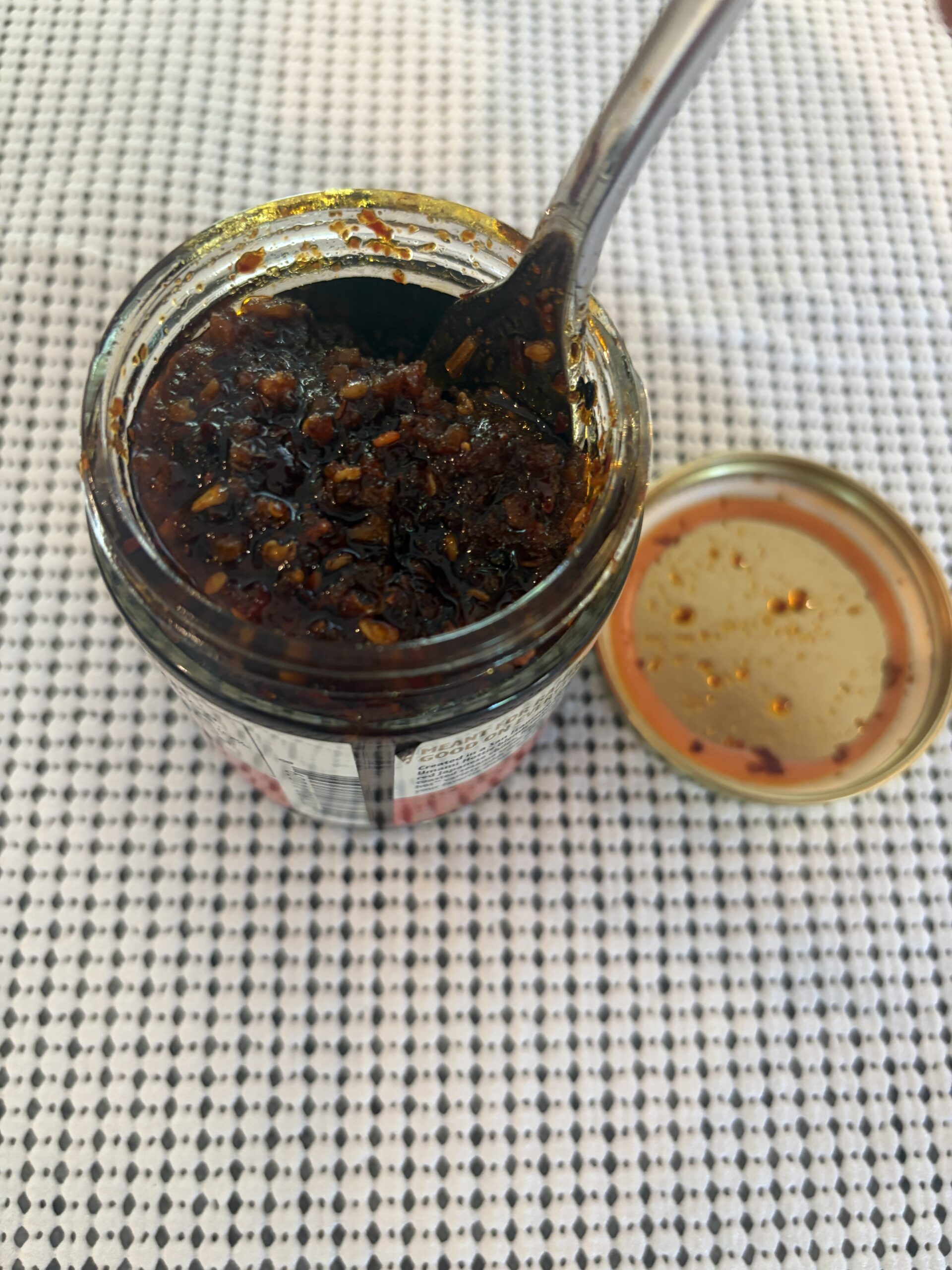 Umami Hottie Original Heat chili oil post-stir wet sand texture — Flavor Index Lab