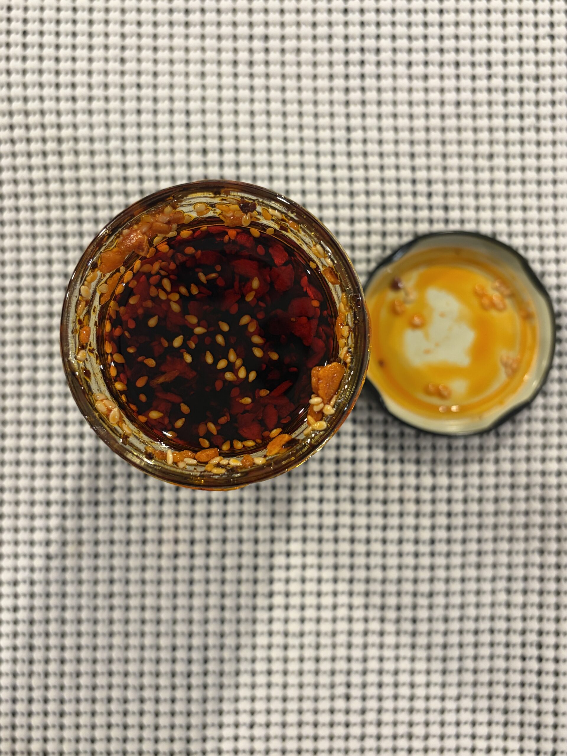 WUJU Original Heat chili crisp open jar showing dense bits — Flavor Index Lab
