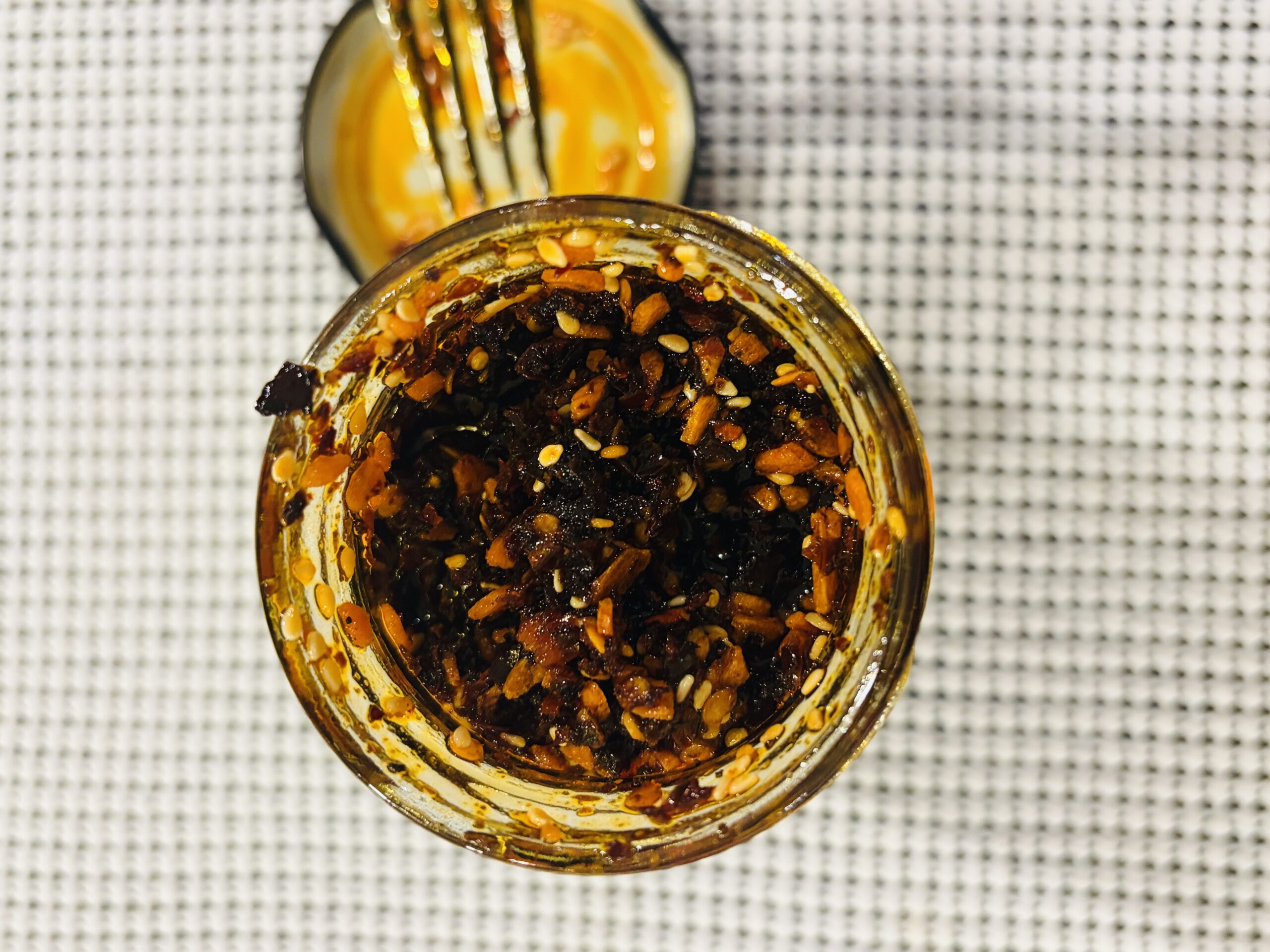 WUJU Original Heat chili crisp settlement showing bits packed to the top — Flavor Index Lab