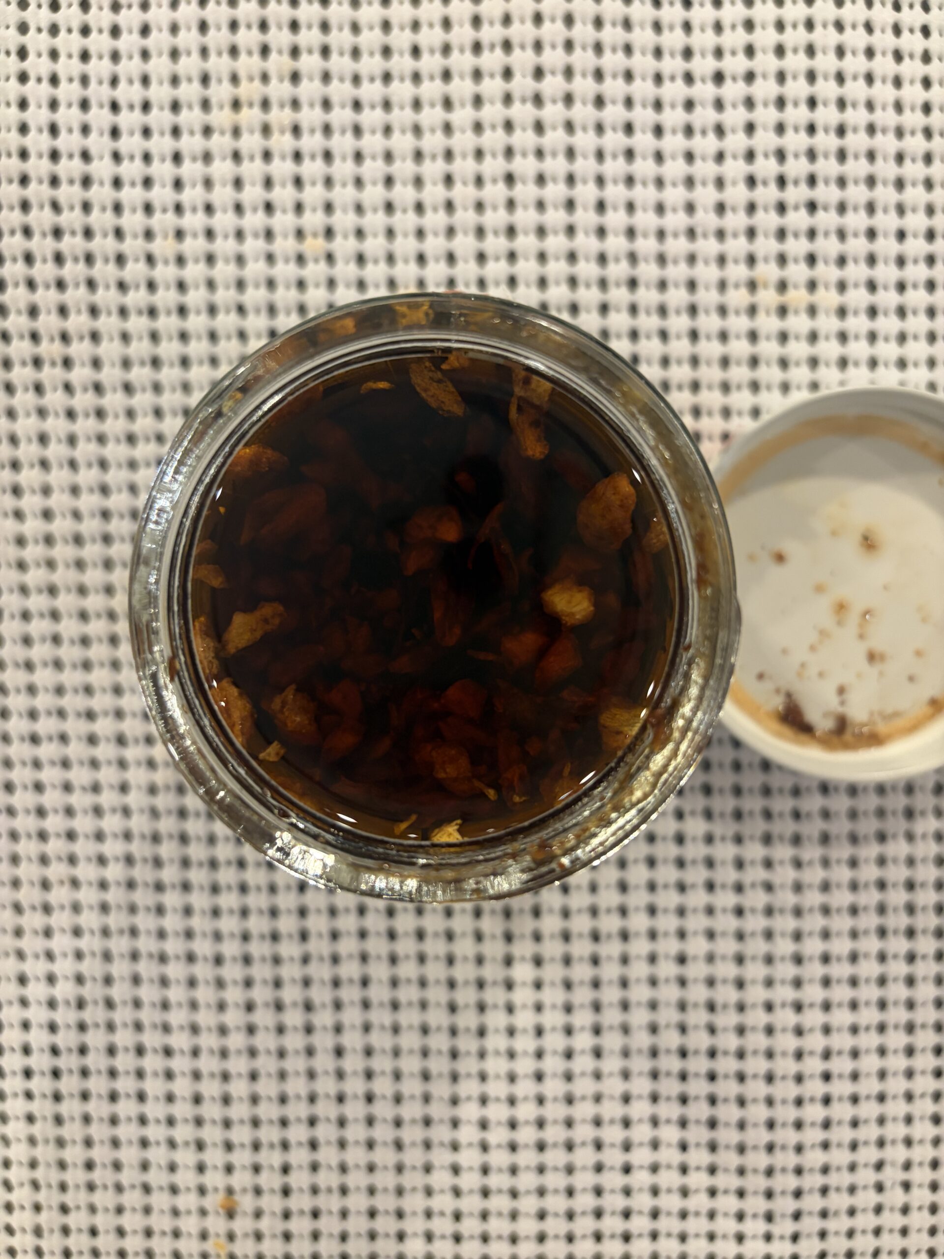 Mama Teav's Mild chili crisp open jar with garlic bits and grapeseed oil — Flavor Index Lab