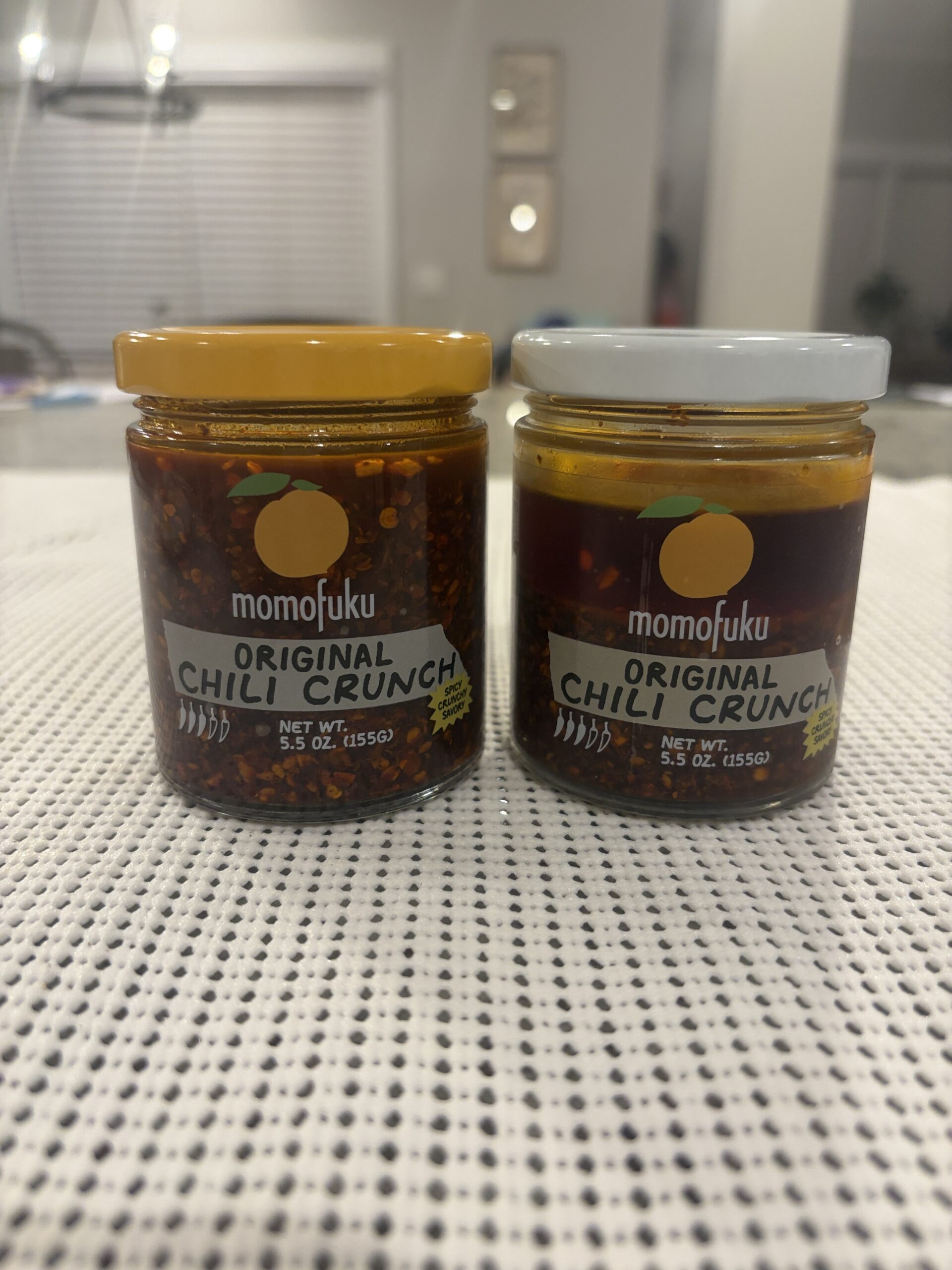 Momofuku Chili Crunch batch comparison white lid and yellow lid jars side by side — Flavor Index Lab