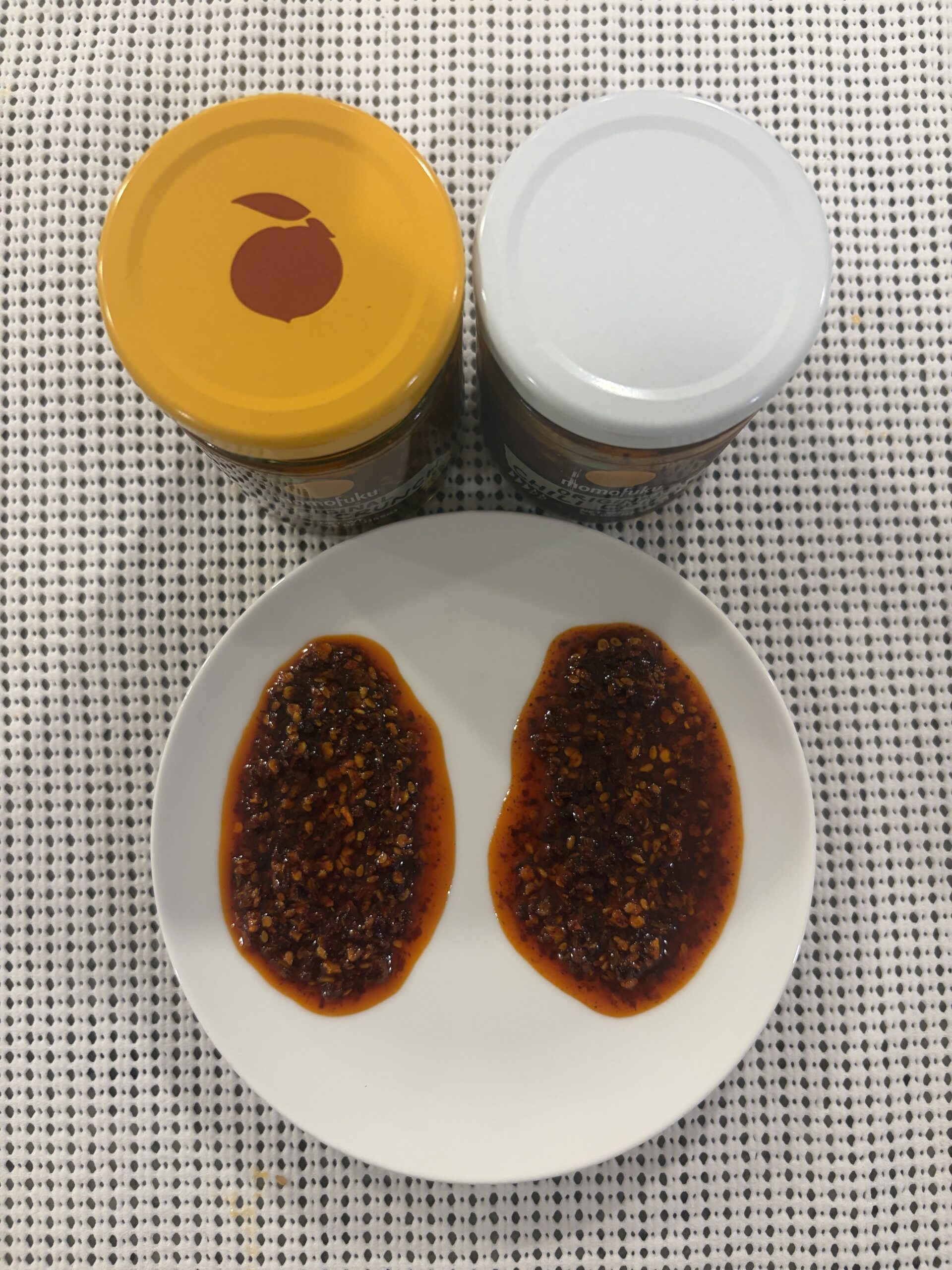 Momofuku Chili Crunch batch comparison top-down view of both jars — Flavor Index Lab