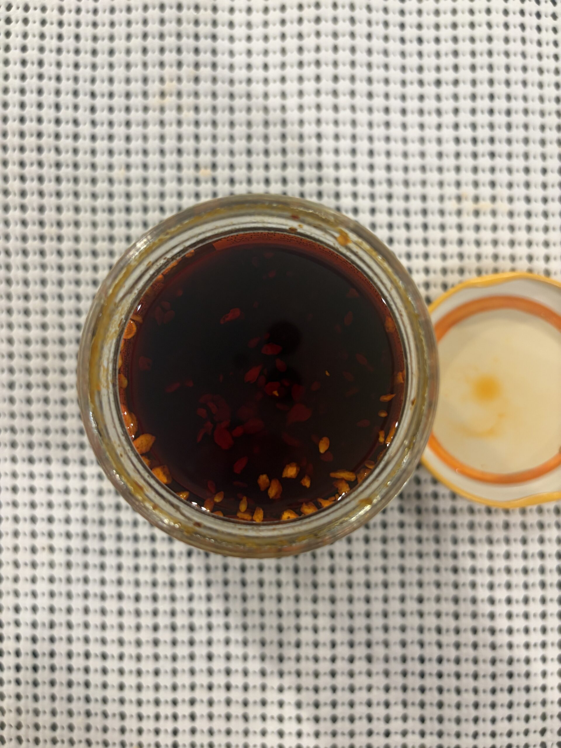 Momofuku Chili Crunch new batch open jar showing seeds and chili bits — Flavor Index Lab
