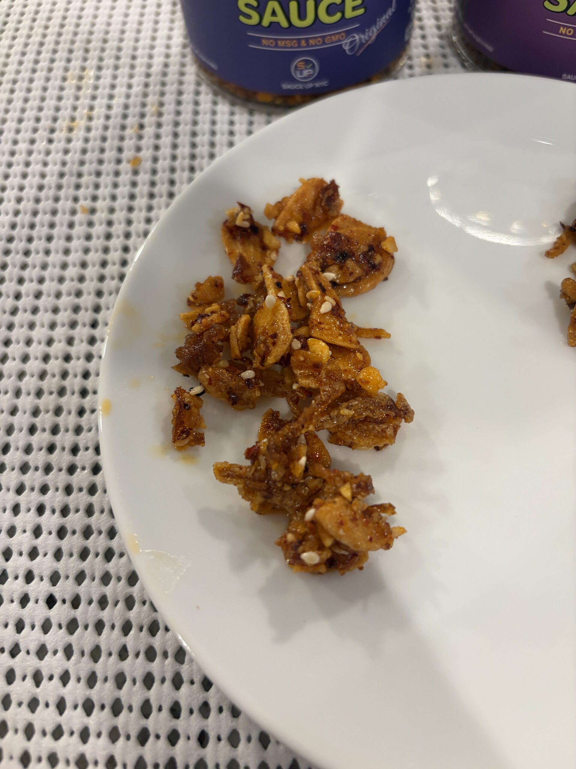 Sauce Up NYC garlic chip Original plated showing garlic granola texture — Flavor Index Lab