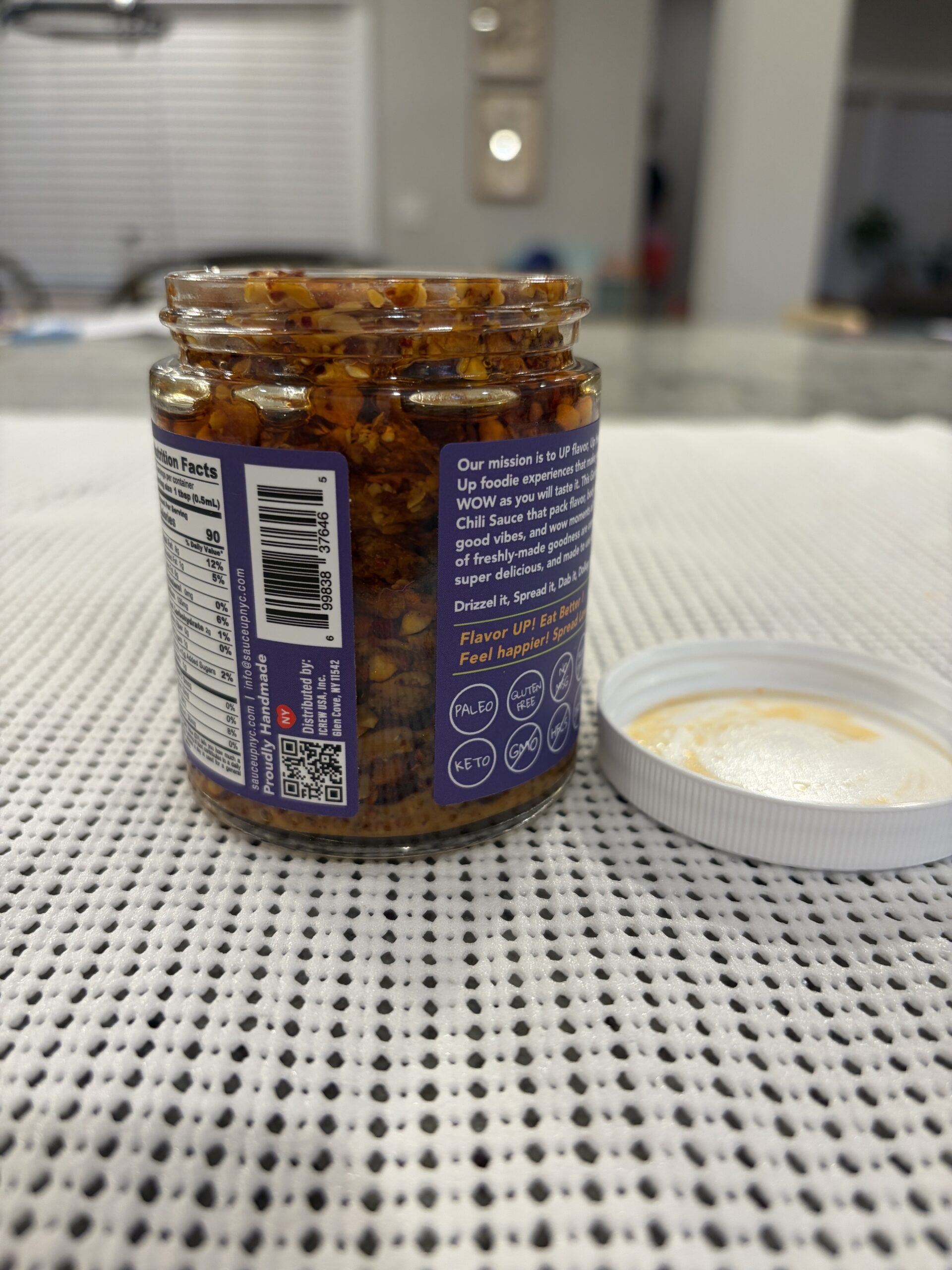 Sauce Up NYC garlic chip review showing packed solids and minimal oil — Flavor Index Lab