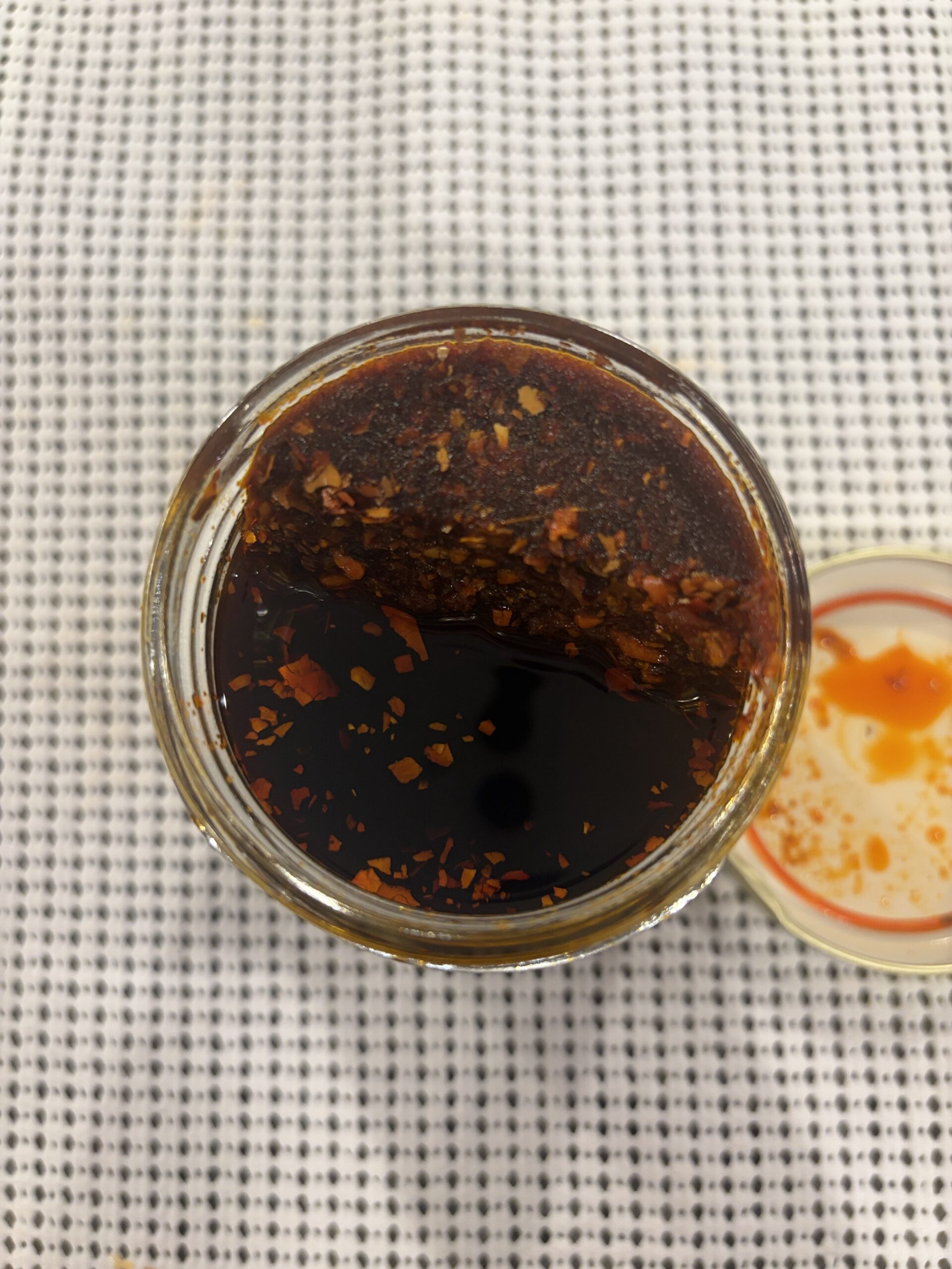 ZINDREW chili oil open jar showing fine garlic and chili bits — Flavor Index Lab