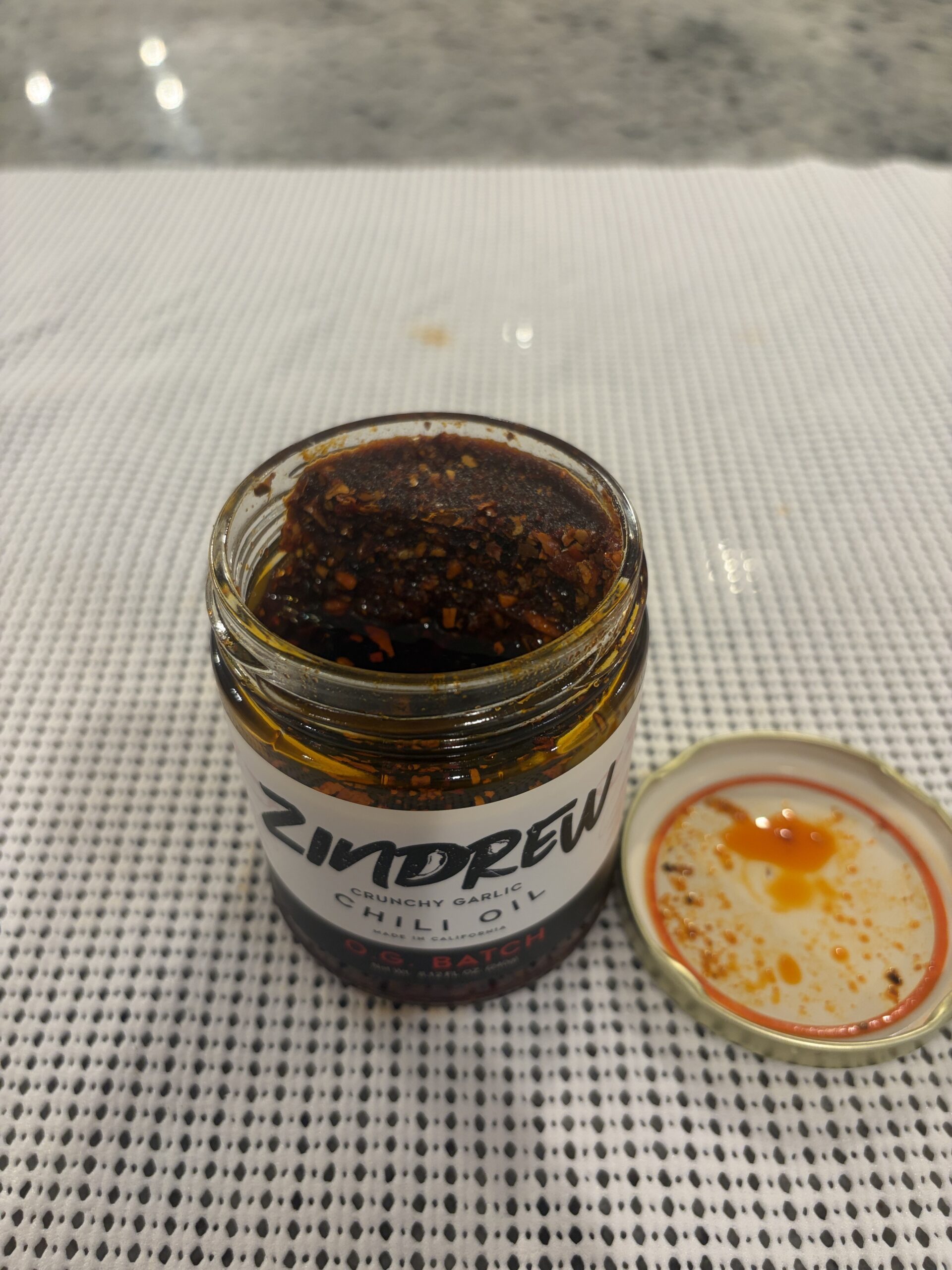 ZINDREW chili oil settlement showing 80 percent solids — Flavor Index Lab