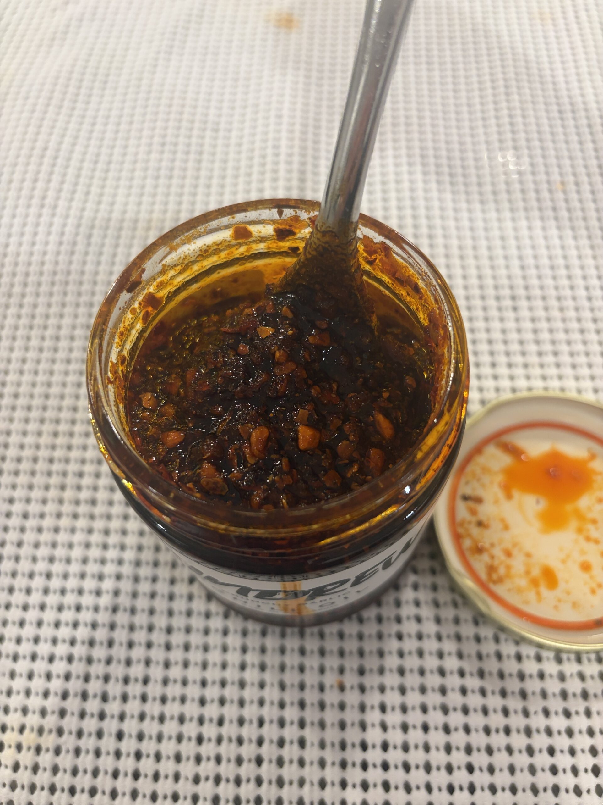 ZINDREW chili oil stirred showing wet sand consistency — Flavor Index Lab