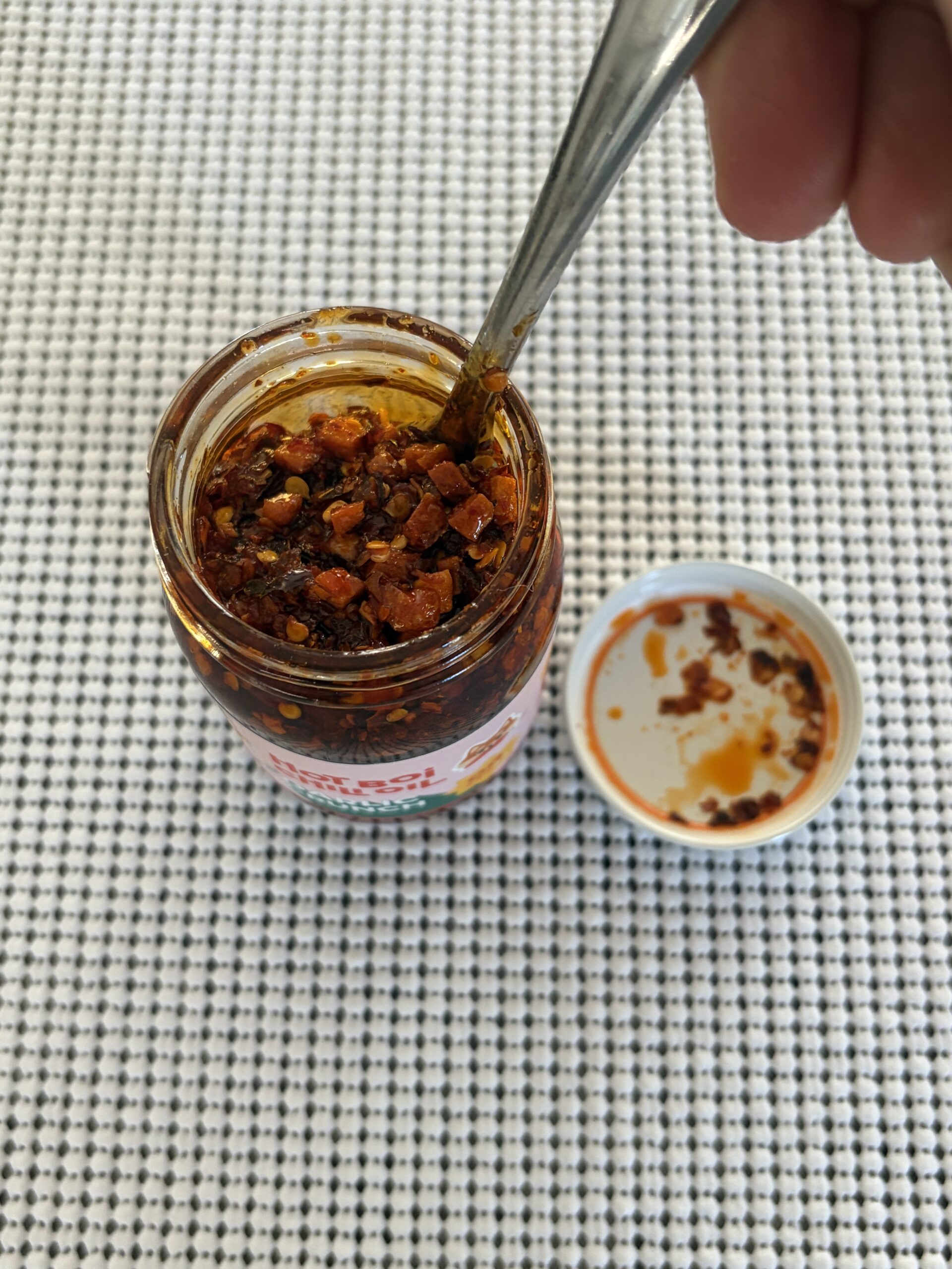 Hot Boi Chili Oil OG after stirring, showing seeds, ground pepper, and garlic — Flavor Index Lab